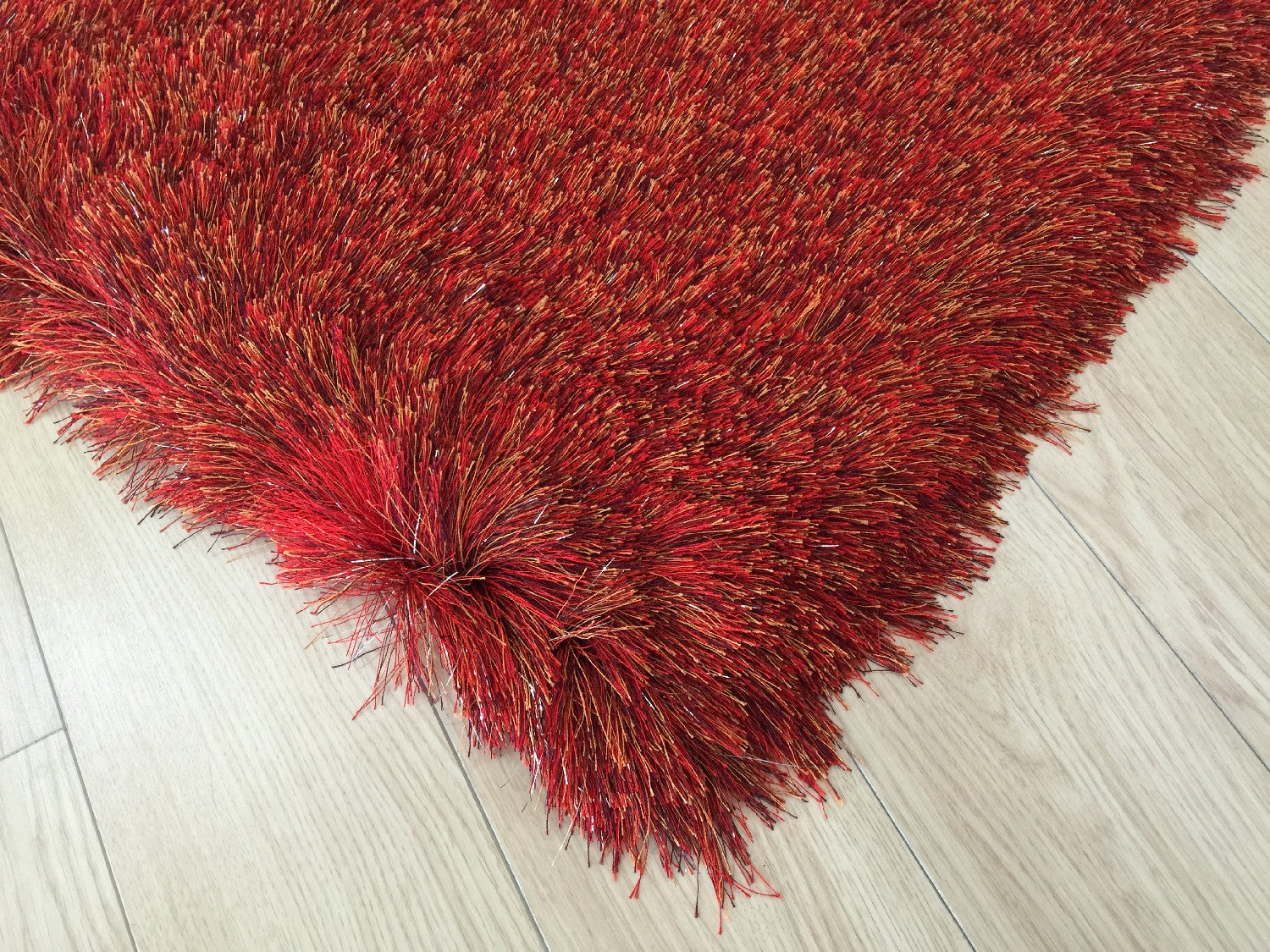 Luxurious Hand-Tufted Red Shag Area Rug for a Cozy and Artistic Room