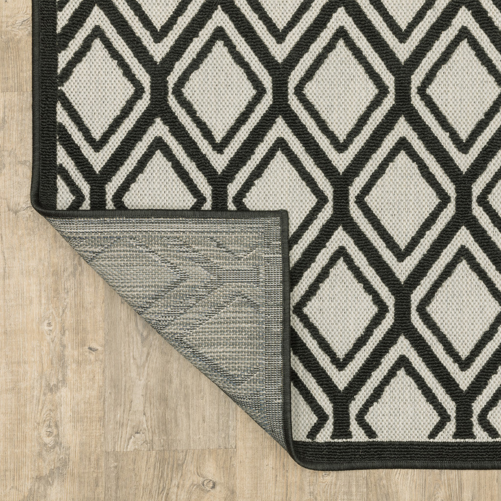 Stylish and Functional Indoor/Outdoor Area Rug - Beige and Black Geometric Design, Stain Resistant for Outdoor and Indoor Spaces