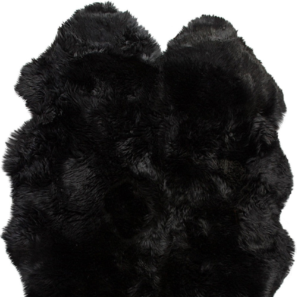 Exquisite Handmade Black Animal Print Area Rug for Living Space Enhancement - A Unique and Stylish Addition